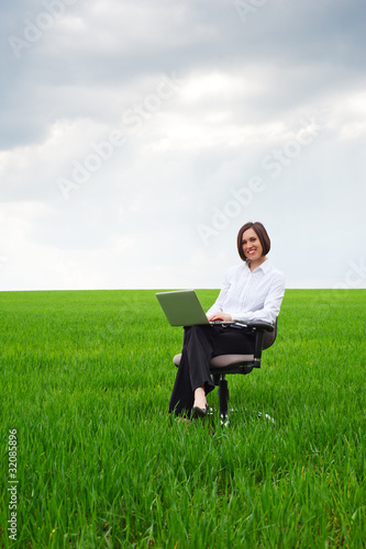 happy businesswoman with computer