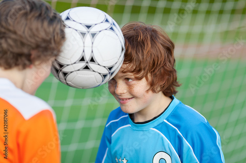 zwei freunde mit fußball photo