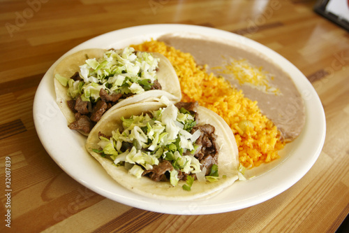 Steak tacos with rice and beans at a taqueria