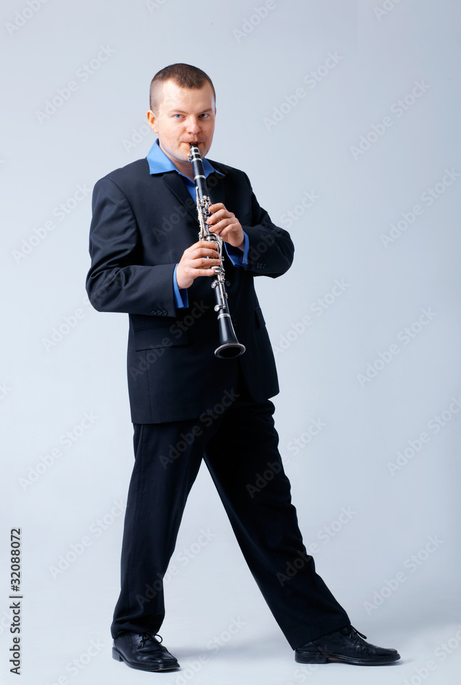 Naklejka premium Flutist is Playing on Flute.