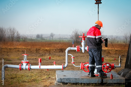 Gas production operator works photo