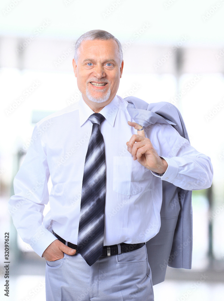 Portrait of a happy senior business man smiling Portrait of a happy senior business man smiling