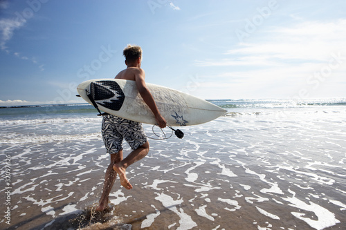 Obraz na plátně Boy surfing