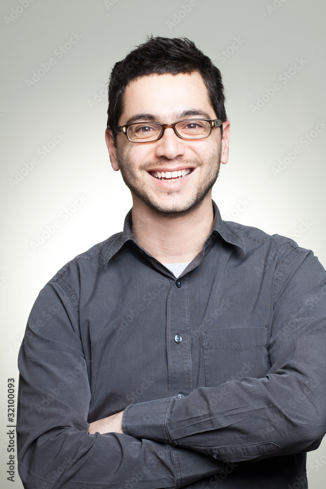 Obraz premium Portrait of young casual man with glasses smiling