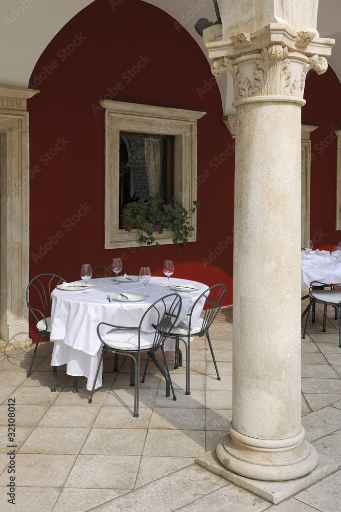 Stylish table setting on terrace restaurant in Sibenik