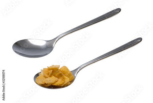 Cornflakes on the spoon and blank spoon, Isolated