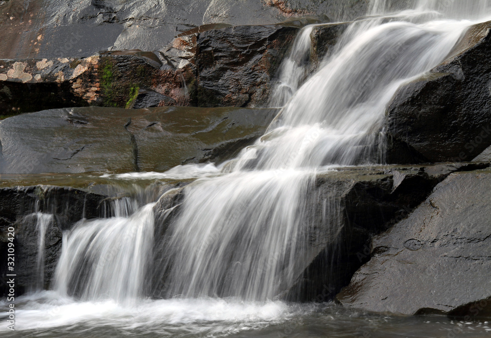 Waterfall at Kaaterskill Falls in Rock Glen. Water is veiled.