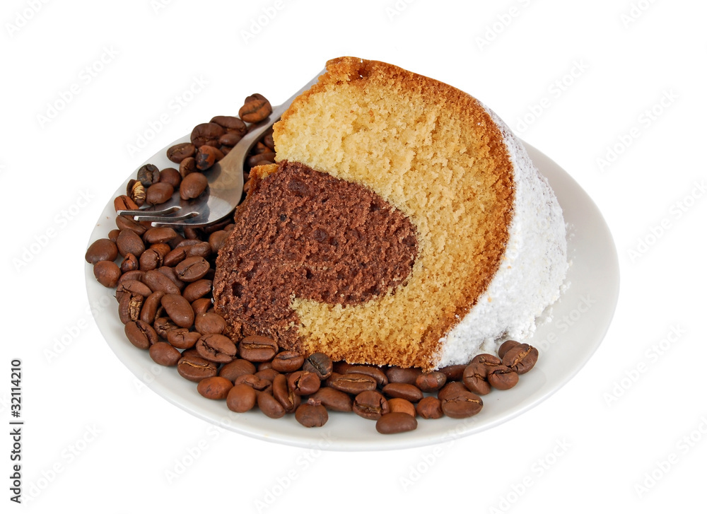 Slice of biscuit cake on coffee seed Slice of biscuit cake on coffee seed