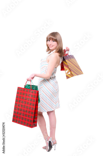 happy girl with purchases. white background, isolated