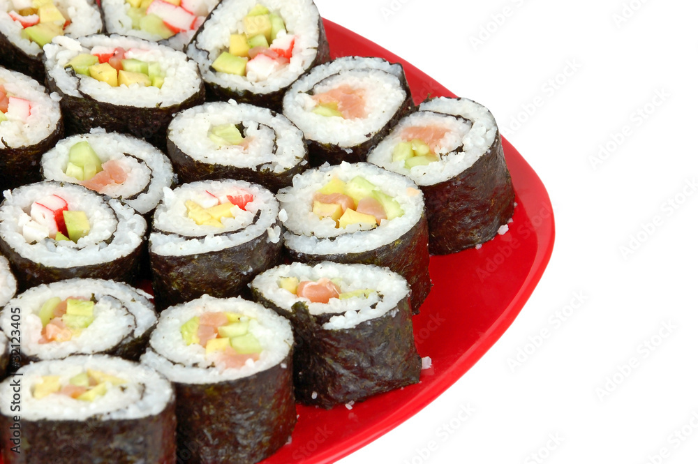 Japanese cuisine - sushi roll on red plate on white backround Japanese cuisine - sushi roll on red plate on white backround
