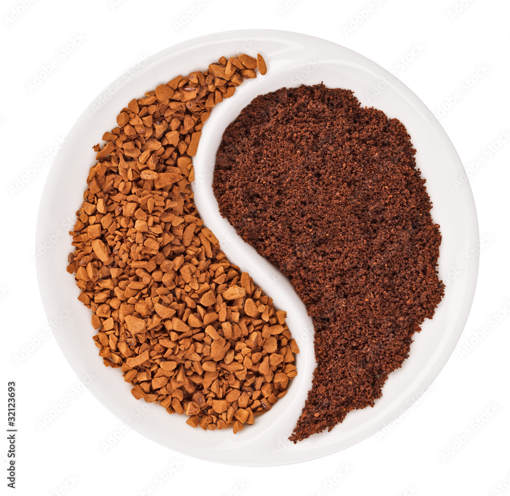 Natural ground coffee versus instant one in Yin Yang shaped plat Natural ground coffee versus instant one in Yin Yang shaped plat