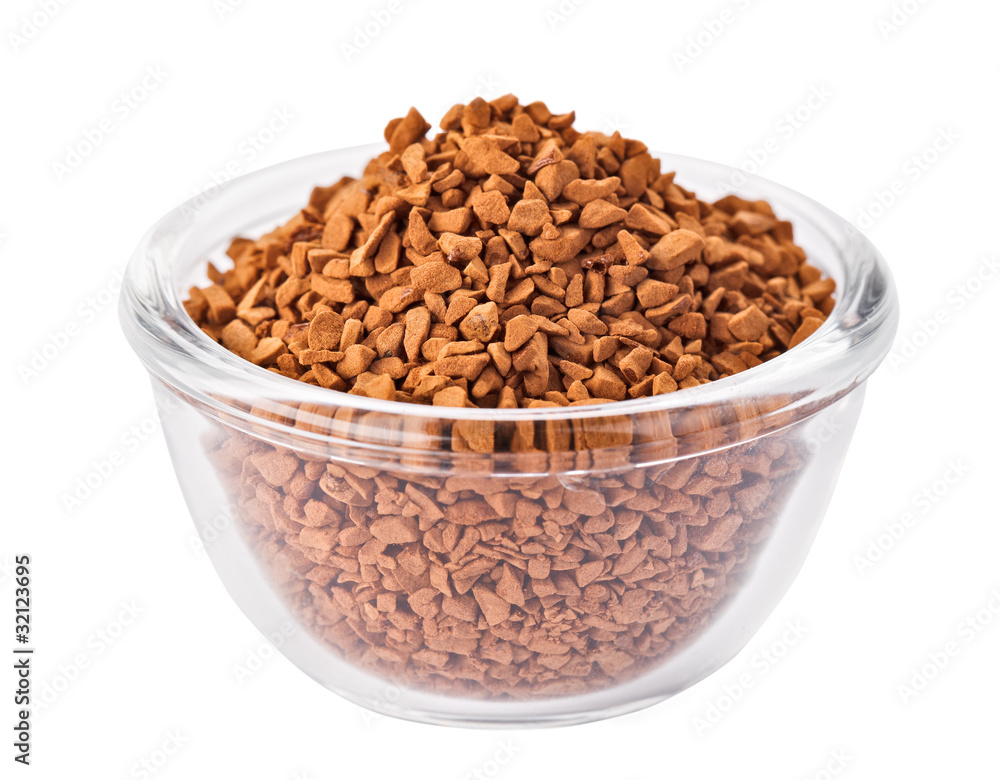 Instant granulated coffee heap in transparent glass bowl, isolat Instant granulated coffee heap in transparent glass bowl, isolat
