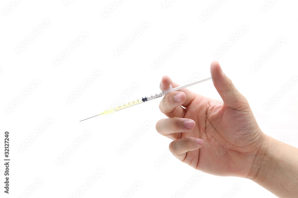 Hand hold disposable syringe isolated on the white background Hand hold disposable syringe isolated on the white background