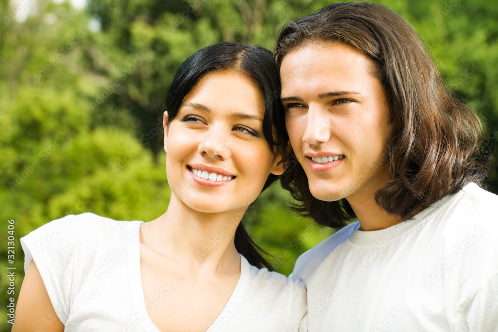 Happy smiling young couple on romantic date outdoors Happy smiling young couple on romantic date outdoors