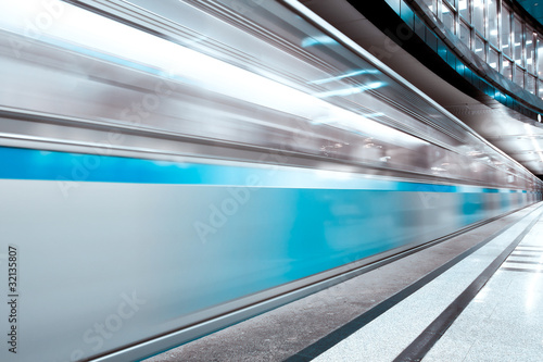 blue fast train in motion