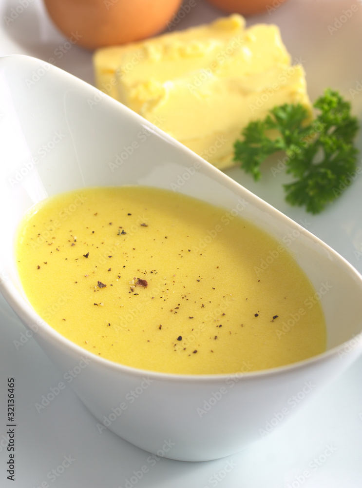 Hollandaise sauce with black pepper on top Hollandaise sauce with black pepper on top