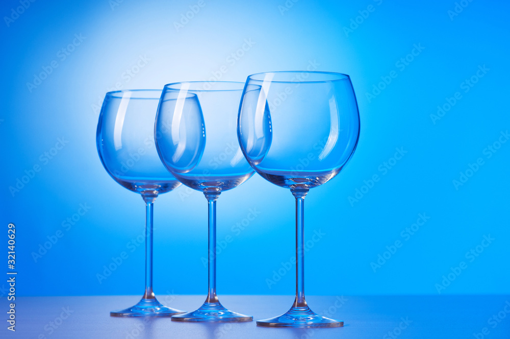 Wine glasses against gradient background Wine glasses against gradient background