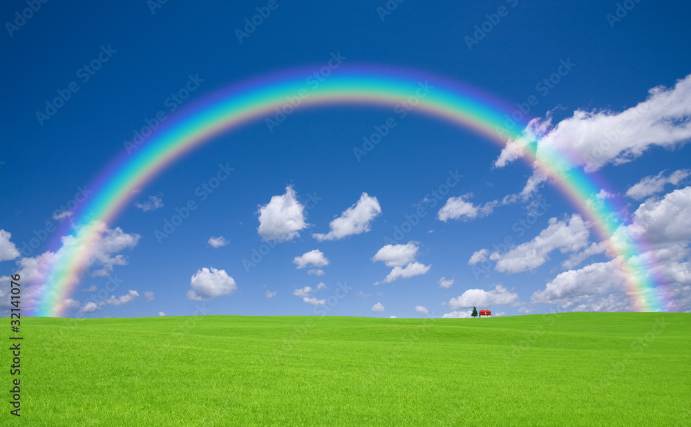 Green grass and red roof house and rainbow Green grass and red roof house and rainbow
