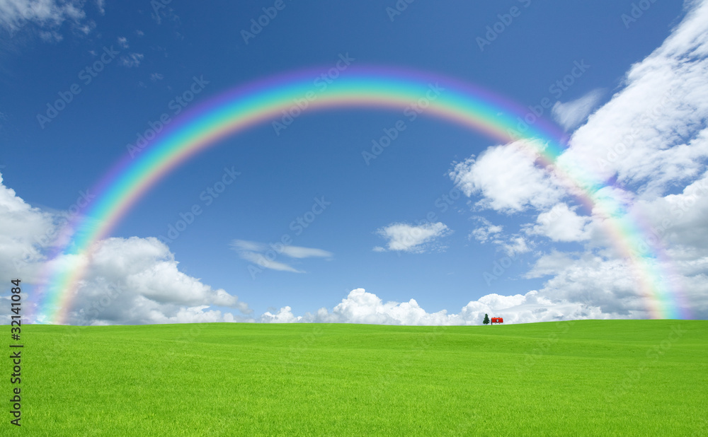 Green grass and red roof house and rainbow Green grass and red roof house and rainbow