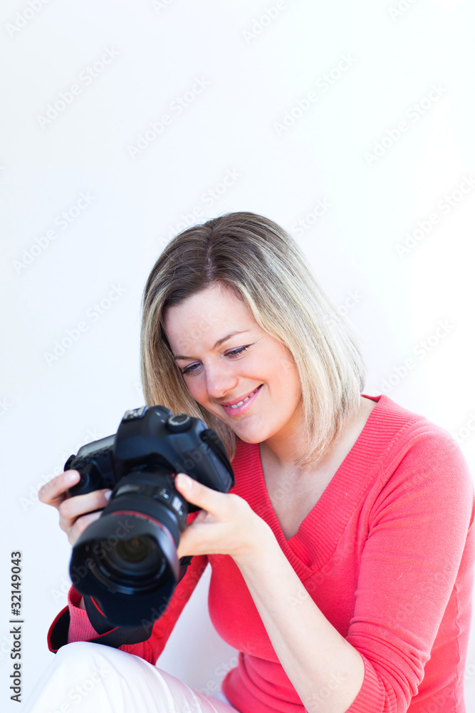 pretty female photographer with her digital camera pretty female photographer with her digital camera