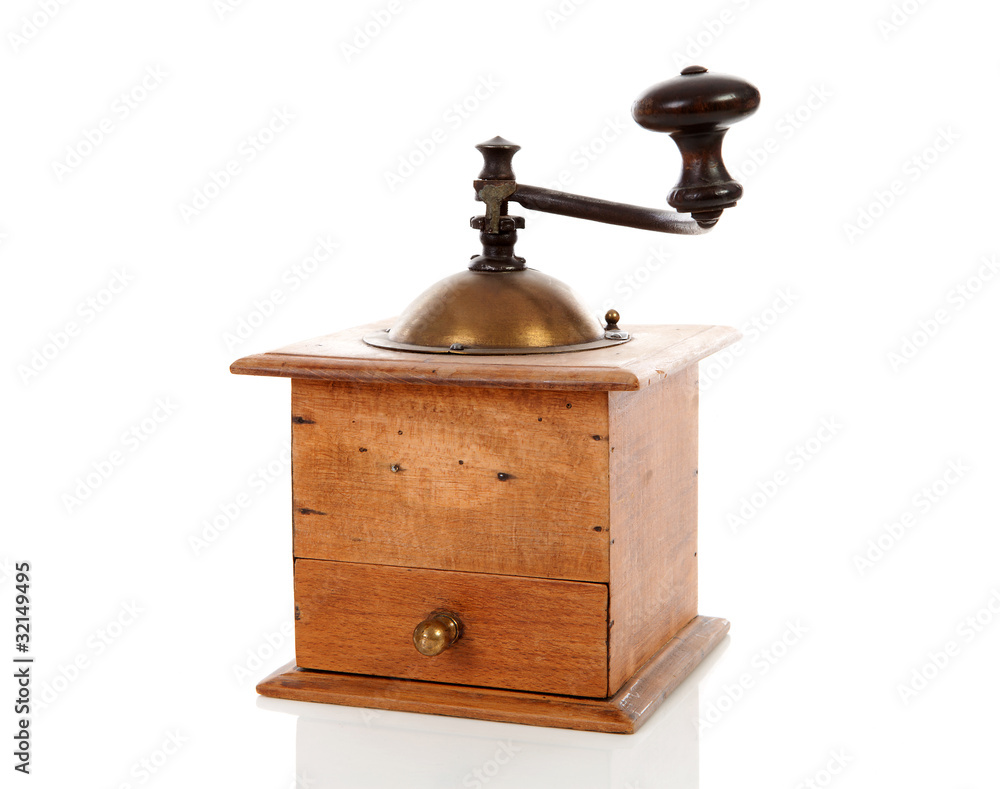 Old wooden coffee grinderover white background Old wooden coffee grinderover white background