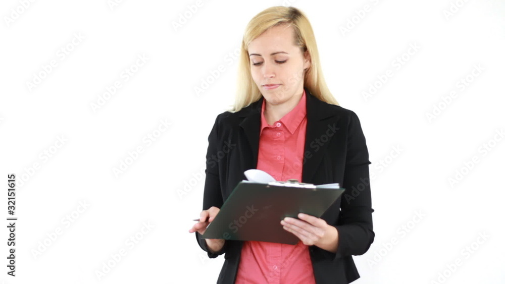Businesswoman signing documents and smiling to the camera