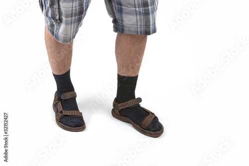 man wearing sandals with socks and having hairy legs. © D. Ott