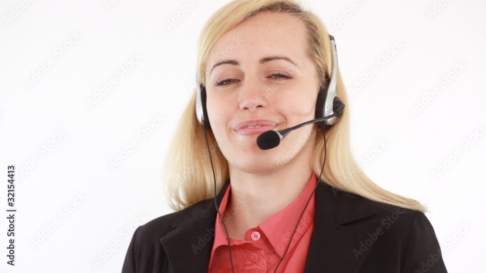 Attractive helpdesk consultant talking on headset, isolated Attractive helpdesk consultant talking on headset, isolated