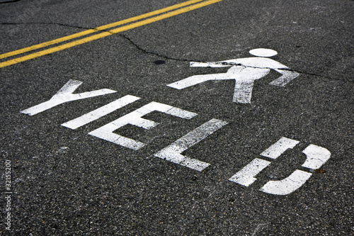 Pedestrian yield sign on a road
