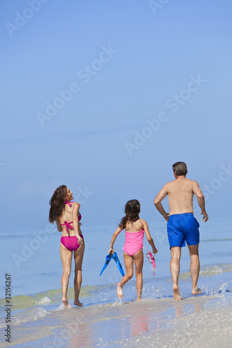 Mother, Father & Daughter Child Family Running on Beach