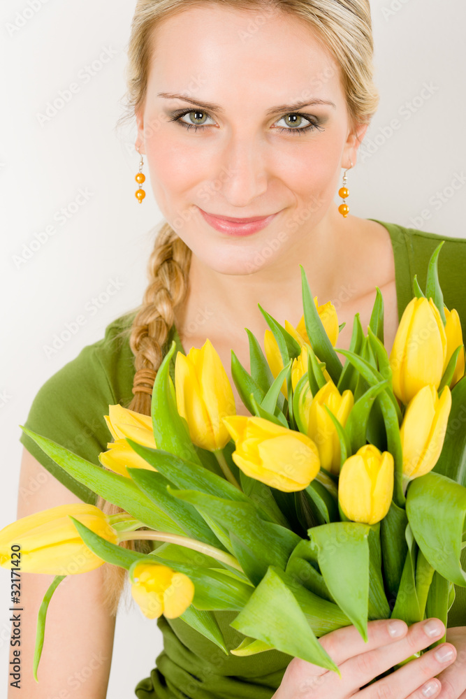 Young woman hold yellow tulips flower Young woman hold yellow tulips flower
