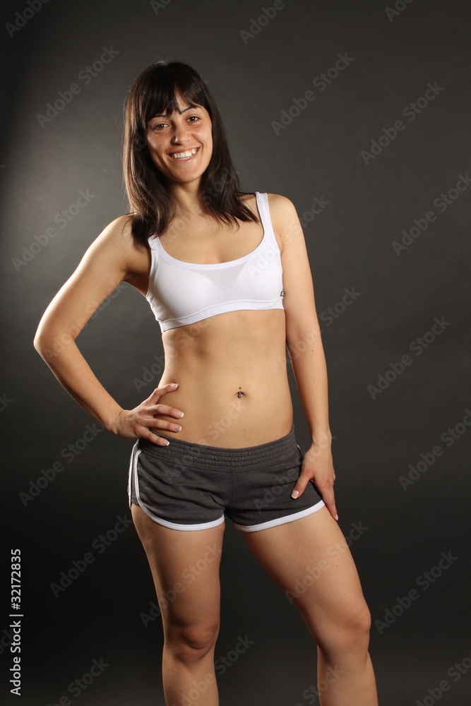 Athletic woman smiling and looking at camera Athletic woman smiling and looking at camera