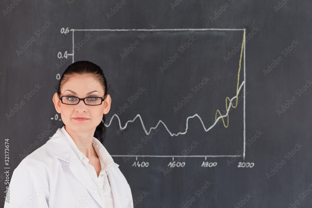 Isolated scientist standing near the blackboard