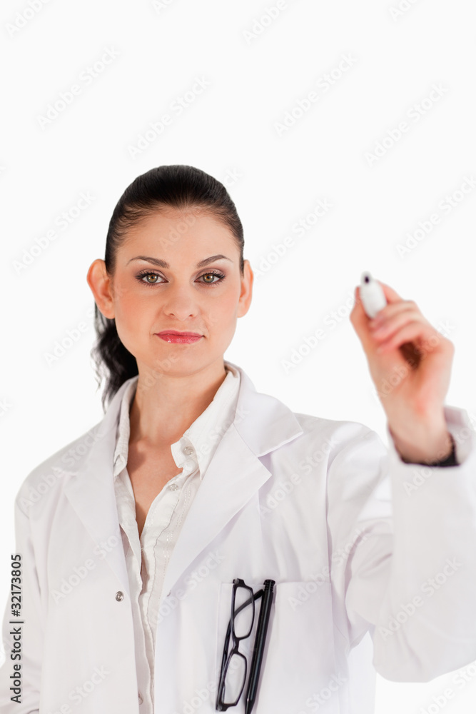 Dark-haired scientist writing on an empty white board Dark-haired scientist writing on an empty white board