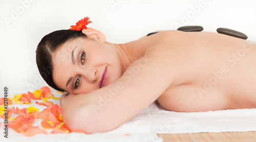 Pretty brunette enjoying the procedure of massage