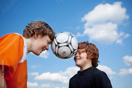 zwei freunde mit fußball photo