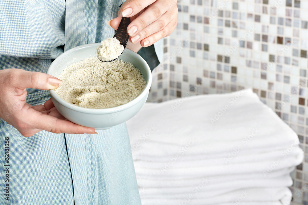 Woman add sea salt into bath. Woman add sea salt into bath.
