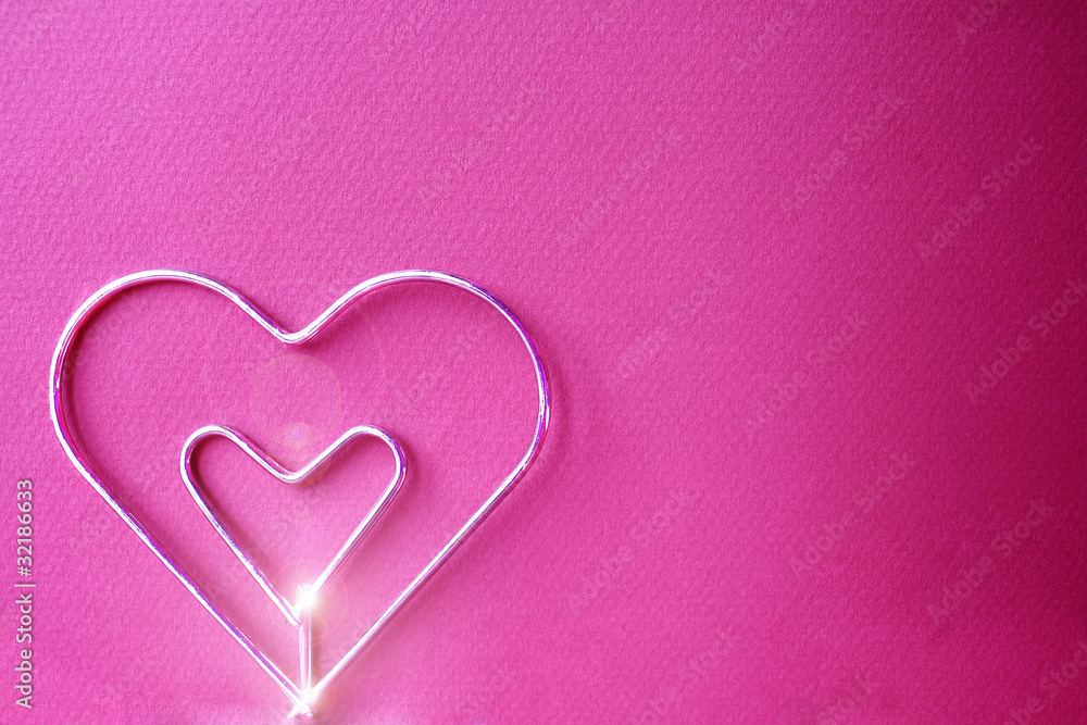 Metal heart with fucsia background