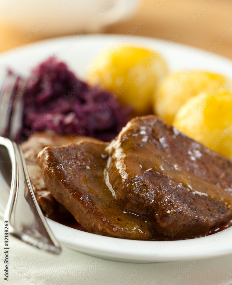 Roast beef with potato dumplings and red cabbage Roast beef with potato dumplings and red cabbage