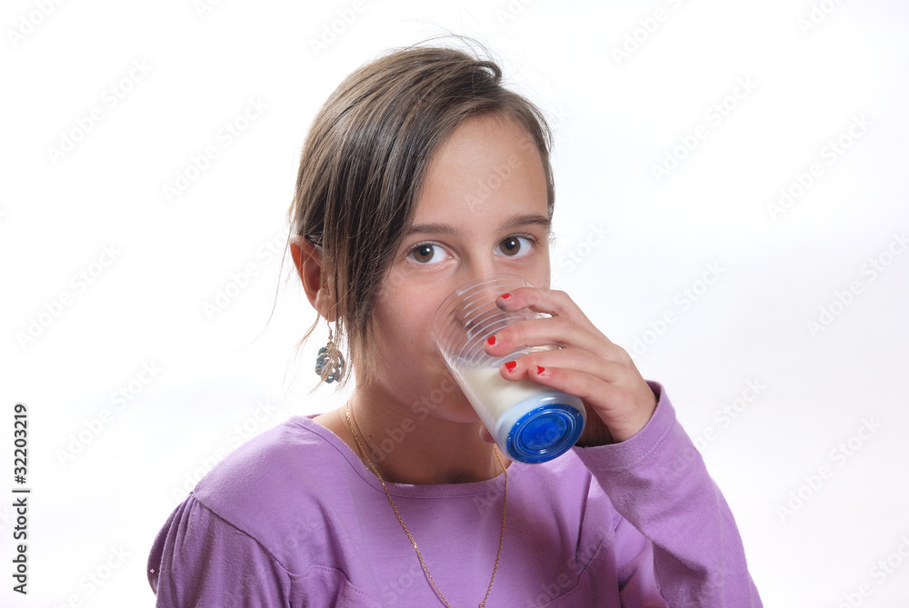 Portrait of a girl drinking a glass of milk Portrait of a girl drinking a glass of milk