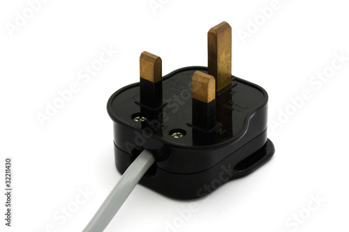 Fotografija Black UK plug with a grey flex over white