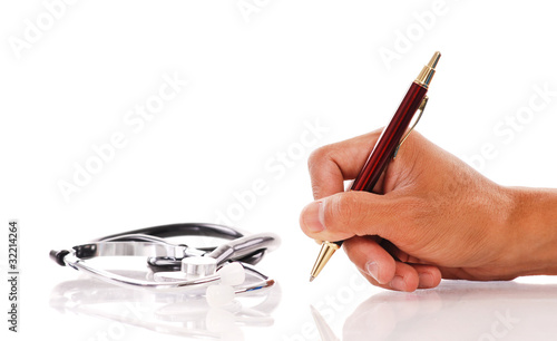 Hand Writing with Pen and Stethoscope photo