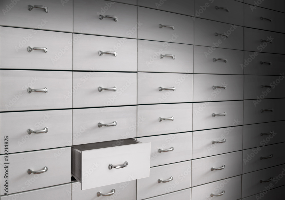 Wooden white drawers in cabinet. Wooden white drawers in cabinet.