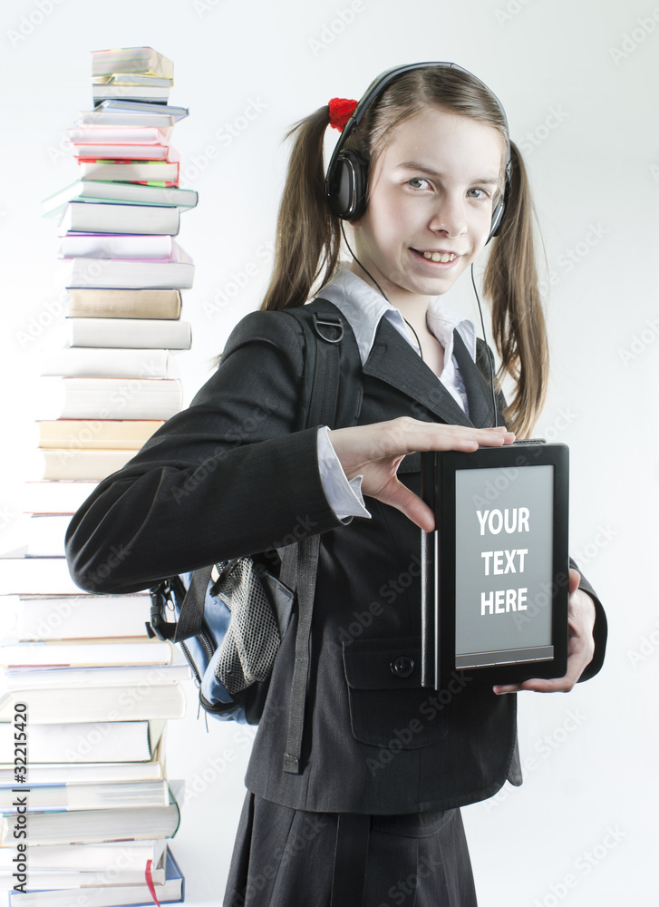 Teen girl with electronic book and stack of printed books