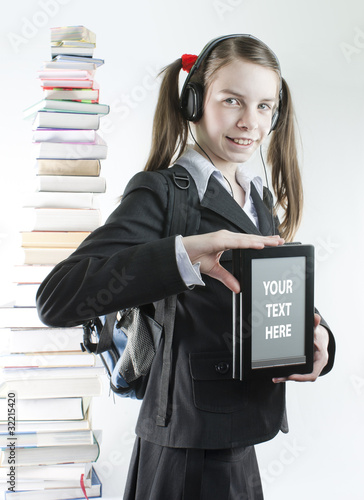 Obraz na płótnie Teen girl with electronic book and stack of printed books w salonie