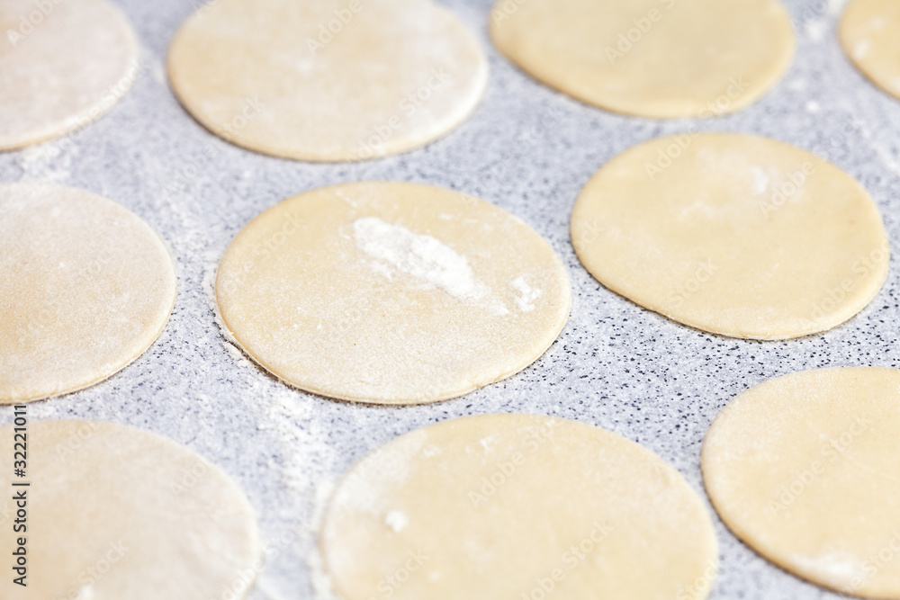 round shape of the dough with flour on the table round shape of the dough with flour on the table