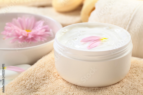 Soft body  hand and face cream with pink petals