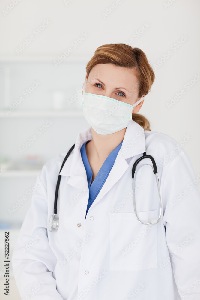 Female scientist with a mask posing Female scientist with a mask posing