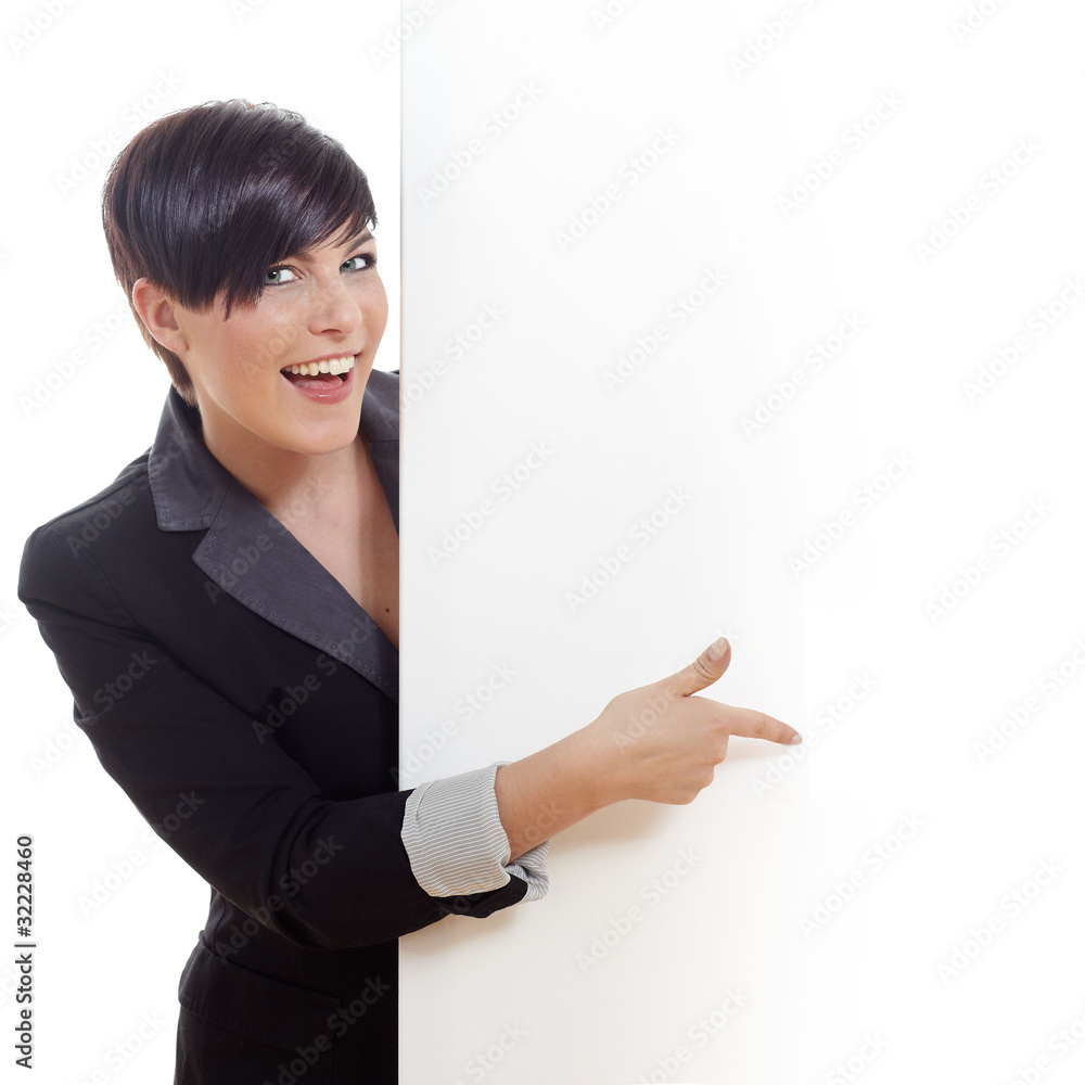 Smiling young business woman behind a clear blackboard Smiling young business woman behind a clear blackboard