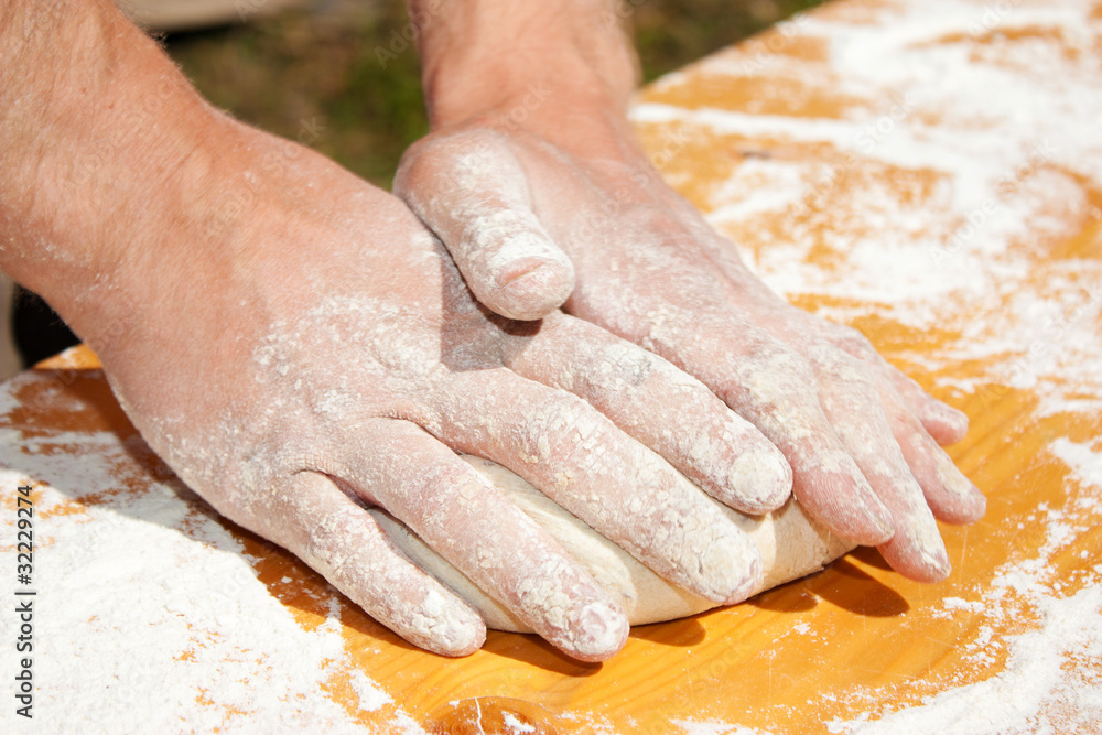 Man hands preparing a little bread